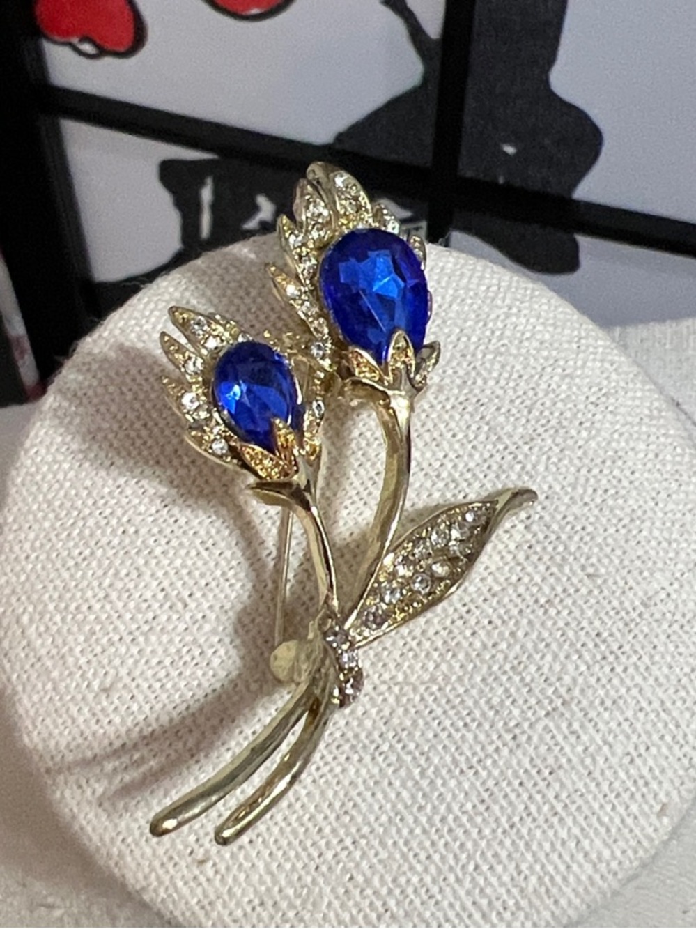 Gold Floral Brooch with Deep Blue Crystal Accents - Elegant Women’s Jewelry